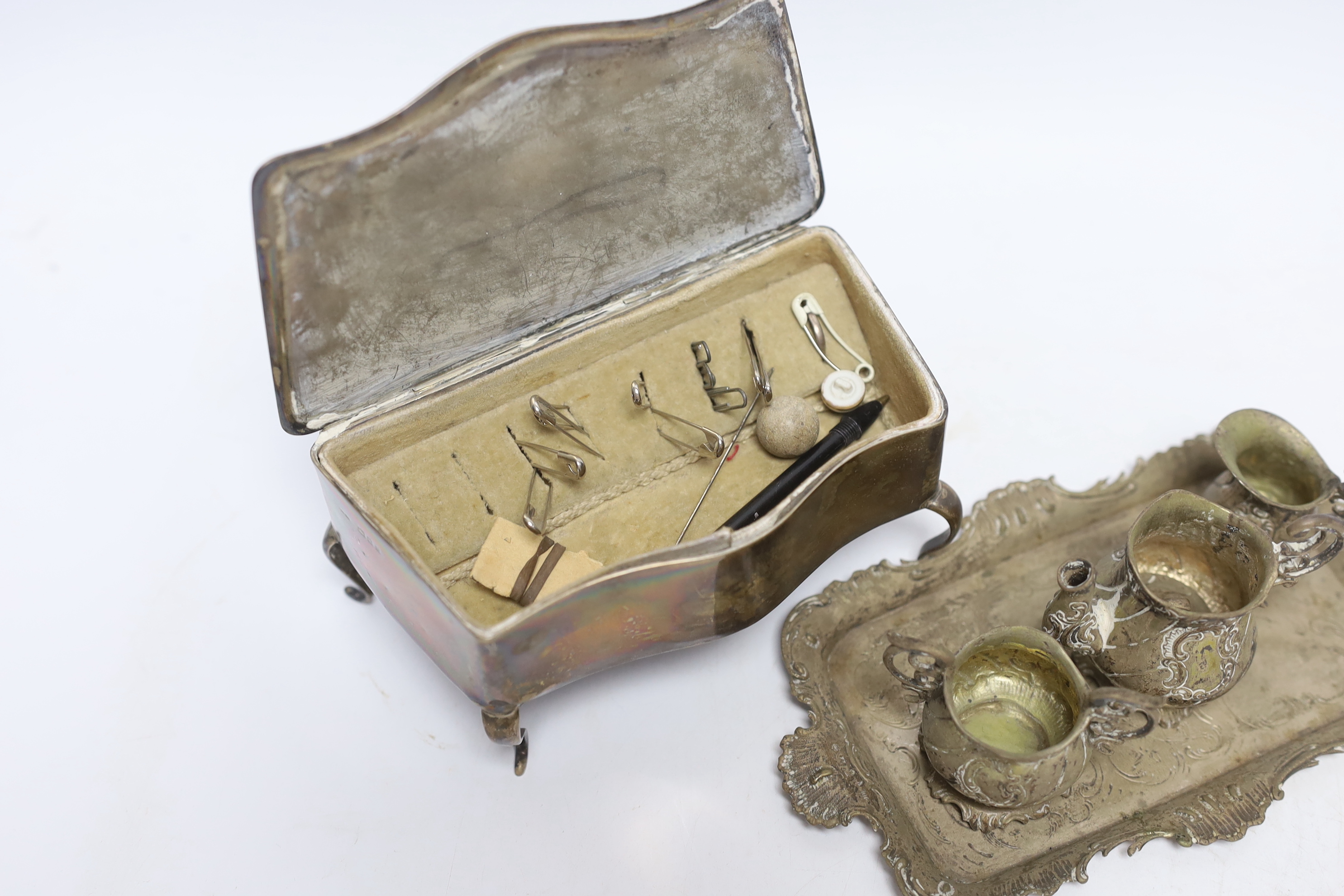 A German Hanau white metal miniature tea set and tray, tray 18.2cm, together with a George V silver mounted trinket box, London, 1922.